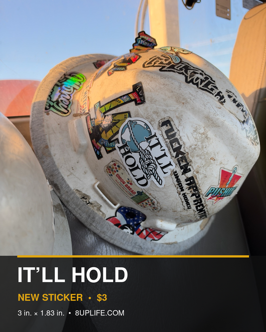 It’ll Hold Sticker on a worn hard hat with product details